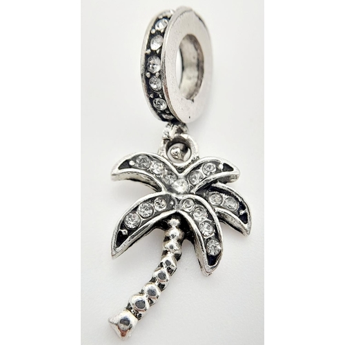 1290 - A PANDORA STERLING SILVER STONE SET PALM TREE DANGLE CHARM. 1.8G, 2.7CM LENGTH. Ref: SC 9008