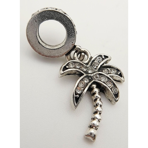 1290 - A PANDORA STERLING SILVER STONE SET PALM TREE DANGLE CHARM. 1.8G, 2.7CM LENGTH. Ref: SC 9008