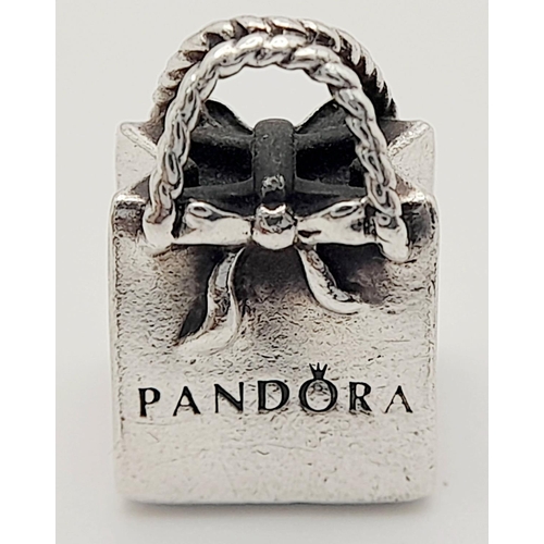 1371 - A PANDORA STERLING SILVER SHOPPING BAG CHARM 4.5G , 14MM X 10MM. Ref: SC 9024