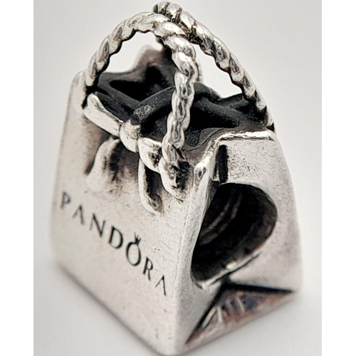 1371 - A PANDORA STERLING SILVER SHOPPING BAG CHARM 4.5G , 14MM X 10MM. Ref: SC 9024