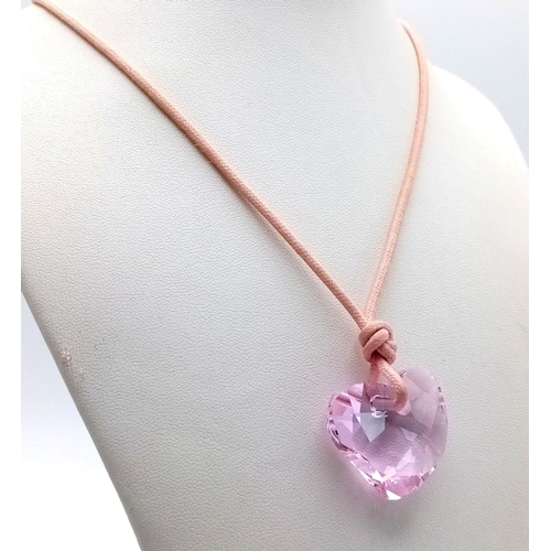 1375 - A SWAROVSKI PURPLE HEART PENDANT WITH ORIGINAL BOX, 26MM X 29MM PENDANT. Ref: SAM 7002