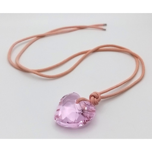 1375 - A SWAROVSKI PURPLE HEART PENDANT WITH ORIGINAL BOX, 26MM X 29MM PENDANT. Ref: SAM 7002