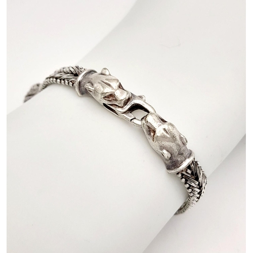 1403 - A STERLING SILVER FANCY LINK BRACELET, WITH JAGUAR HEAD . 16.6G TOTAL WEIGHT, 19.5CM IN LENGTH. Ref:... 