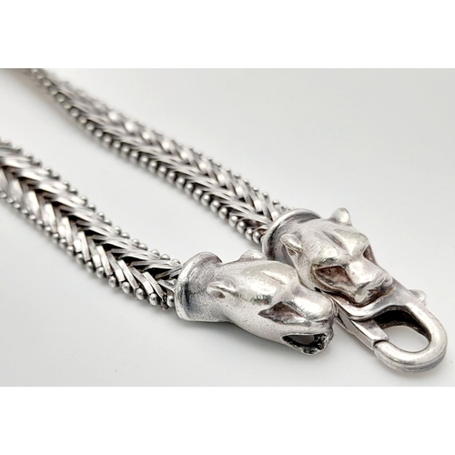 1403 - A STERLING SILVER FANCY LINK BRACELET, WITH JAGUAR HEAD . 16.6G TOTAL WEIGHT, 19.5CM IN LENGTH. Ref:... 