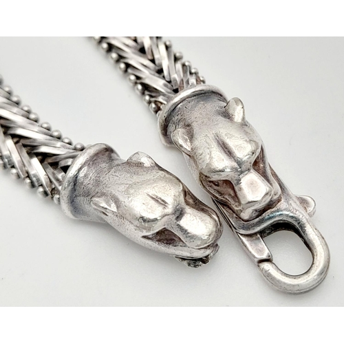 1403 - A STERLING SILVER FANCY LINK BRACELET, WITH JAGUAR HEAD . 16.6G TOTAL WEIGHT, 19.5CM IN LENGTH. Ref:... 