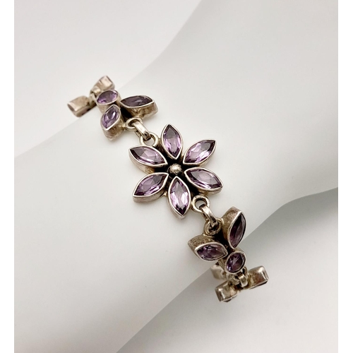 1413 - A STERLING SILVER AMETHYST SET FLOWER BRACELET 16.2G , 20.8CM LENGTH. Ref: JB 7001