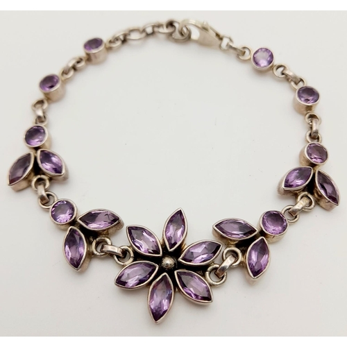 1413 - A STERLING SILVER AMETHYST SET FLOWER BRACELET 16.2G , 20.8CM LENGTH. Ref: JB 7001