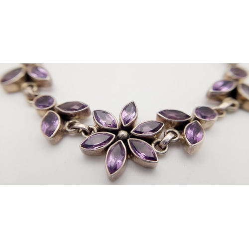 1413 - A STERLING SILVER AMETHYST SET FLOWER BRACELET 16.2G , 20.8CM LENGTH. Ref: JB 7001