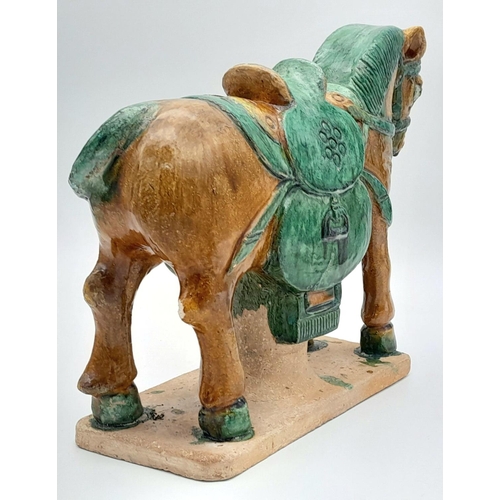 604 - A SUPERB LATE MING DYNASTY POTTERY HORSE ON BASE. ORIGNALLY PURCHASED FROM SOTHERBYS IN 2005. STILL ... 