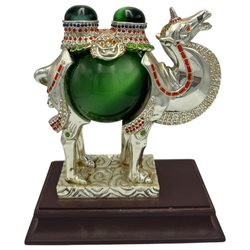 1353 - A fantastic collector's piece: natural Cat's Eye Stones set in a Feng Shui Camel Symbol. Expertly cr... 