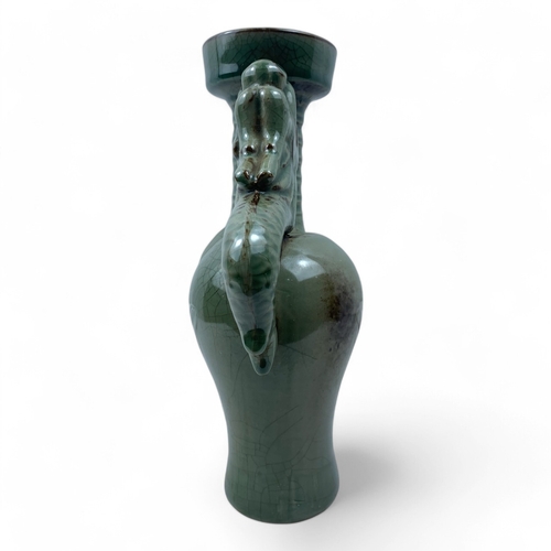 1240 - A Chinese Antique Celadon Double-Dragon Ceramic Vase.
Lovely green celadon featuring a crackle finis... 