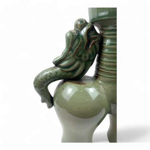 1240 - A Chinese Antique Celadon Double-Dragon Ceramic Vase.
Lovely green celadon featuring a crackle finis... 