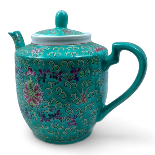 1325 - A Chinese Jingdezhen Turquoise Porcelain Tea Set. Turquoise and multicolored hand-painted floral and... 