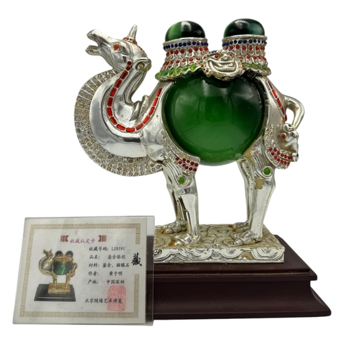 1353 - A fantastic collector's piece: natural Cat's Eye Stones set in a Feng Shui Camel Symbol. Expertly cr... 