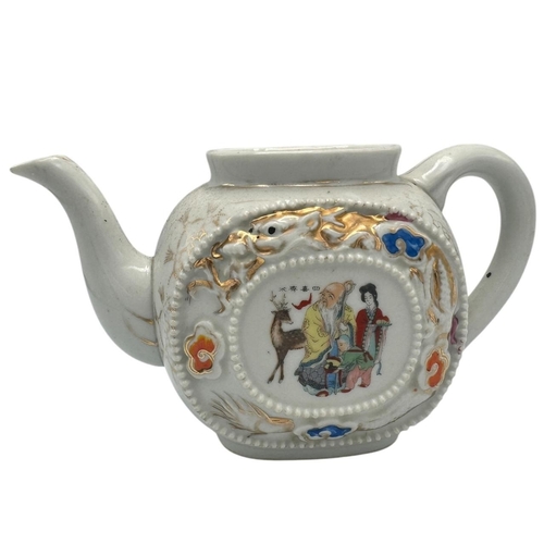 1373 - A Chinese export Porcelain Teapot with Hand-Painted Details. White porcelain exterior with multicolo... 