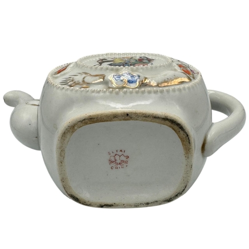 1373 - A Chinese export Porcelain Teapot with Hand-Painted Details. White porcelain exterior with multicolo... 