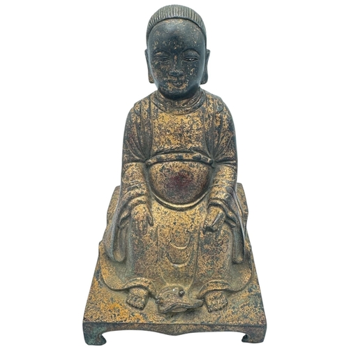 1401 - An antique Chinese large Bronze Seated deity Sculpture. 
Bronze exterior with aged patina and carved... 