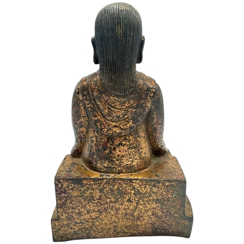 1401 - An antique Chinese large Bronze Seated deity Sculpture. 
Bronze exterior with aged patina and carved... 