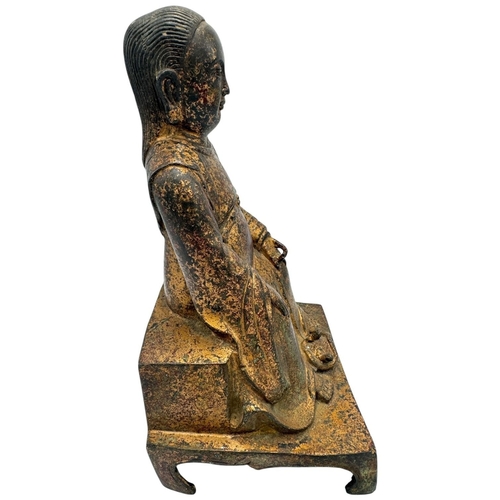 1401 - An antique Chinese large Bronze Seated deity Sculpture. 
Bronze exterior with aged patina and carved... 