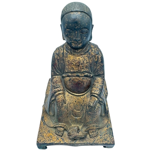 1401 - An antique Chinese large Bronze Seated deity Sculpture. 
Bronze exterior with aged patina and carved... 