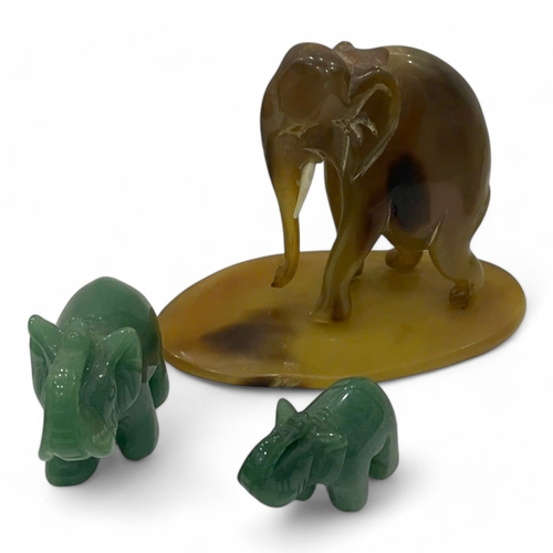 1943 - A Marble and Horn Elephant Sculpture Set. Handcrafted marble and horn materials with polished surfac... 