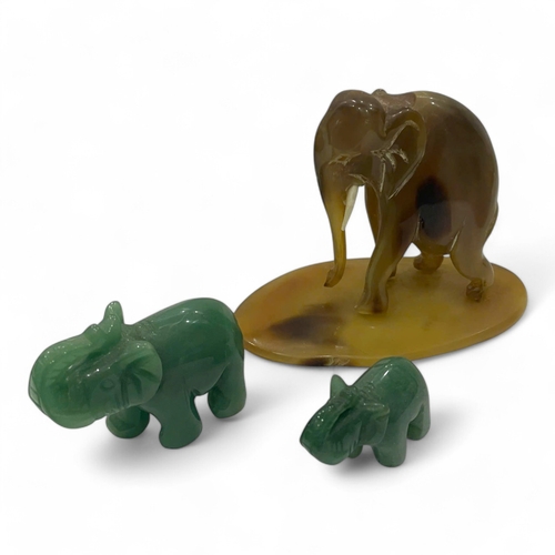 1943 - A Marble and Horn Elephant Sculpture Set. Handcrafted marble and horn materials with polished surfac... 