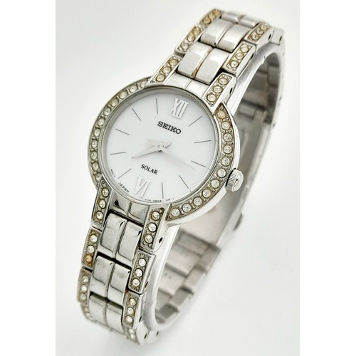 388 - A Vintage Seiko Solar Ladies Watch. Stainless steel bracelet and case - 25mm. Stone set bezel. White... 