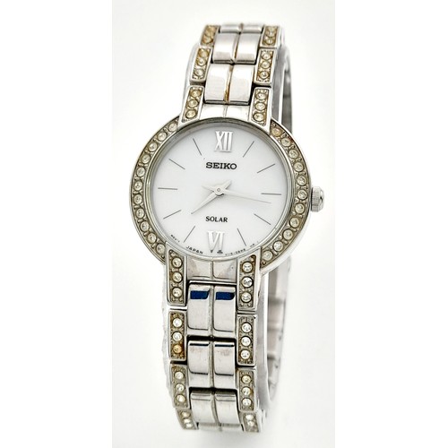 388 - A Vintage Seiko Solar Ladies Watch. Stainless steel bracelet and case - 25mm. Stone set bezel. White... 