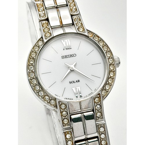 388 - A Vintage Seiko Solar Ladies Watch. Stainless steel bracelet and case - 25mm. Stone set bezel. White... 