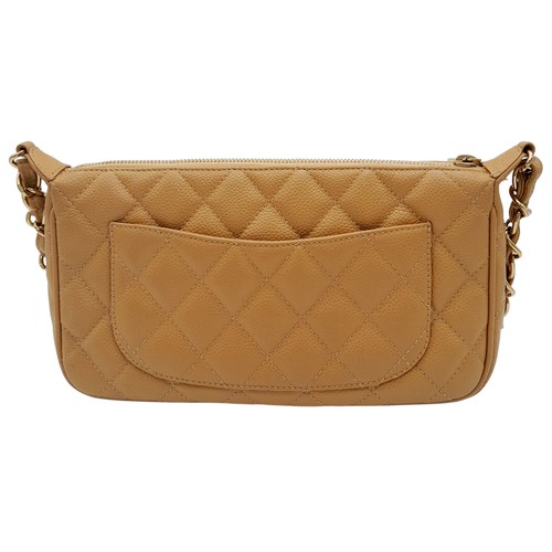 158 - A Chanel Beige Caviar Leather Shoulder Bag. Beige caviar leather exterior with gold-toned hardware a... 