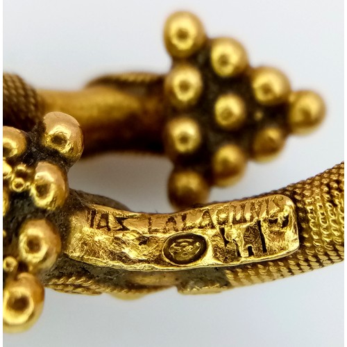 163 - An 18K Gold Etruscan Style Crossover Ring. Size F. 8.2g.