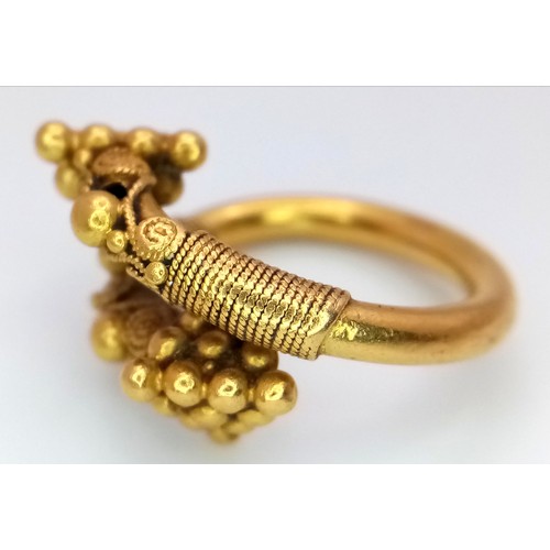 163 - An 18K Gold Etruscan Style Crossover Ring. Size F. 8.2g.