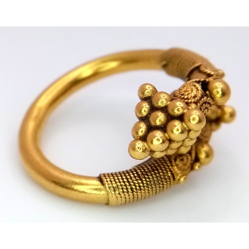 163 - An 18K Gold Etruscan Style Crossover Ring. Size F. 8.2g.