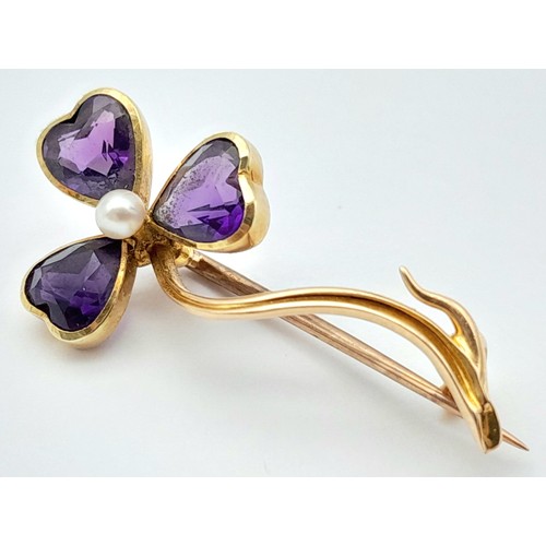 444 - An Antique 15K Yellow Gold, Amethyst and Pearl Brooch. 3.5cm. 3g