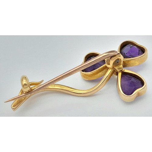 444 - An Antique 15K Yellow Gold, Amethyst and Pearl Brooch. 3.5cm. 3g