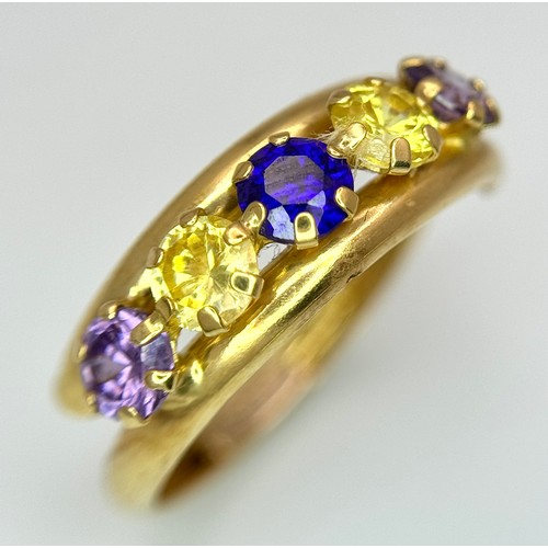 458 - An 18K Yellow Gold Gem Set Crossover Ring. Size O 1/2. 2.2g