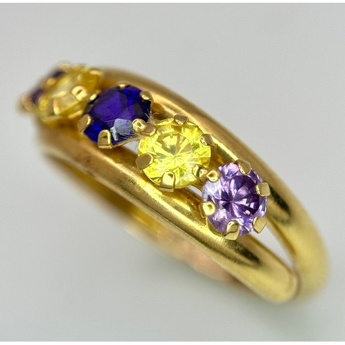 458 - An 18K Yellow Gold Gem Set Crossover Ring. Size O 1/2. 2.2g