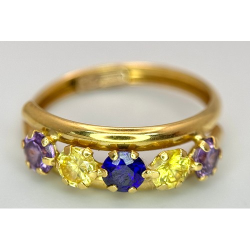 458 - An 18K Yellow Gold Gem Set Crossover Ring. Size O 1/2. 2.2g