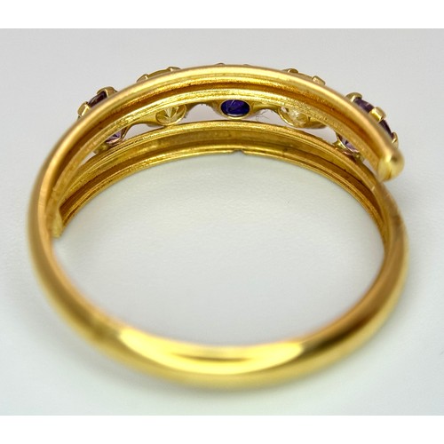 458 - An 18K Yellow Gold Gem Set Crossover Ring. Size O 1/2. 2.2g