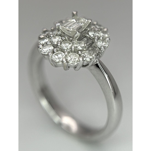 1504 - A BEAUTIFUL 18K WHITE GOLD, EMERALD CUT AND ROUND BRILLIANT CUT DIAMOND CLUSTER RING - 1CTW APPROX. ... 