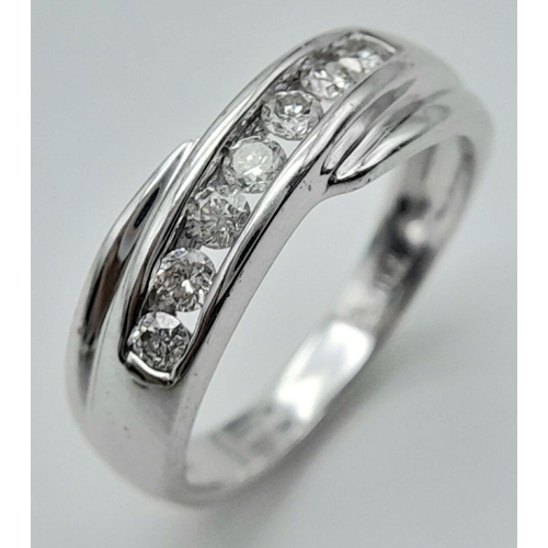 1523 - AN 18K WHITE GOLD DIAMOND CROSSOVER RING - 0.25CTW. 4.4G. SIZE M 1/2. SPEN6003