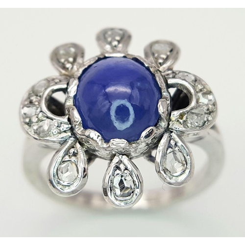 1714 - AN 18K WHITE GOLD DIAMOND & STAR SAPPHIRE RING. 6.3G IN WEIGHT. SIZE O AND 1/2. Ref: 8808