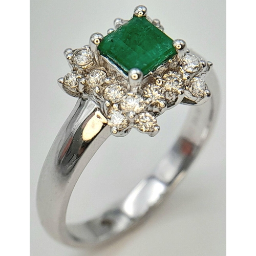 2016 - AN 18K WHITE GOLD DIAMOND AND EMERALD CLUSTER RING. 0.38CTW DIAMONDS AND 0.52CT EMERALD. 4.5G. SIZE ... 