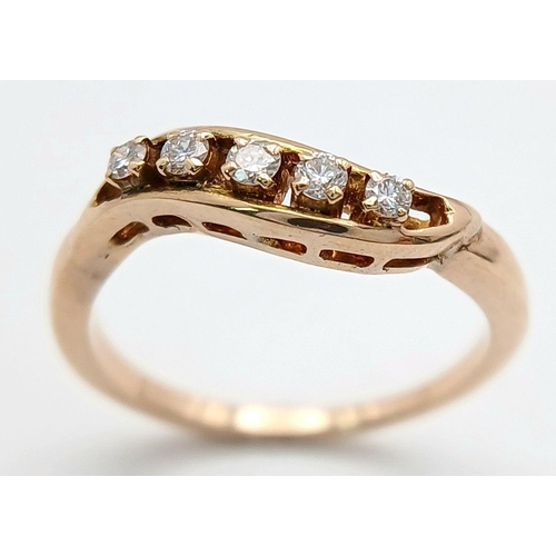 1615 - A 14K YELLOW GOLD DIAMOND TWIST BAND RING - 0.25CTW. 2.8G. SIZE O 1/2. A/S 1175