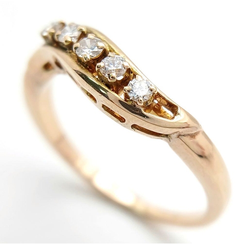 1615 - A 14K YELLOW GOLD DIAMOND TWIST BAND RING - 0.25CTW. 2.8G. SIZE O 1/2. A/S 1175