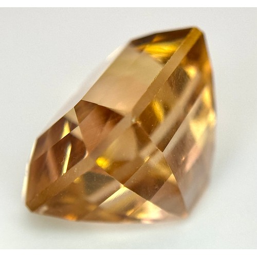 1123 - A 13.76ct Rare Imperial Topaz, Pakistan origin, in octagon step cut. Comes with GFCO certificate.