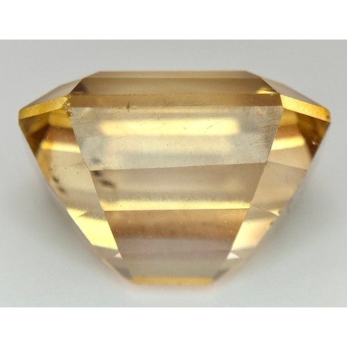 1123 - A 13.76ct Rare Imperial Topaz, Pakistan origin, in octagon step cut. Comes with GFCO certificate.