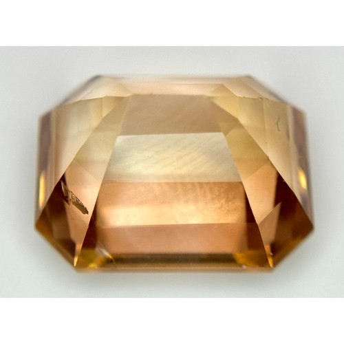 1123 - A 13.76ct Rare Imperial Topaz, Pakistan origin, in octagon step cut. Comes with GFCO certificate.