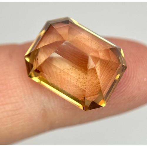 1123 - A 13.76ct Rare Imperial Topaz, Pakistan origin, in octagon step cut. Comes with GFCO certificate.