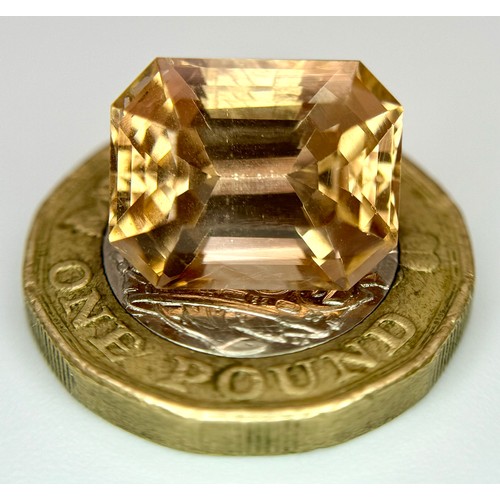 1123 - A 13.76ct Rare Imperial Topaz, Pakistan origin, in octagon step cut. Comes with GFCO certificate.